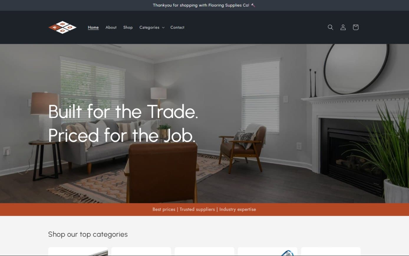 The Flooring Supplies Co homepage, headed Built for the Trade. Priced for the Job. over a living room with dark wood floors