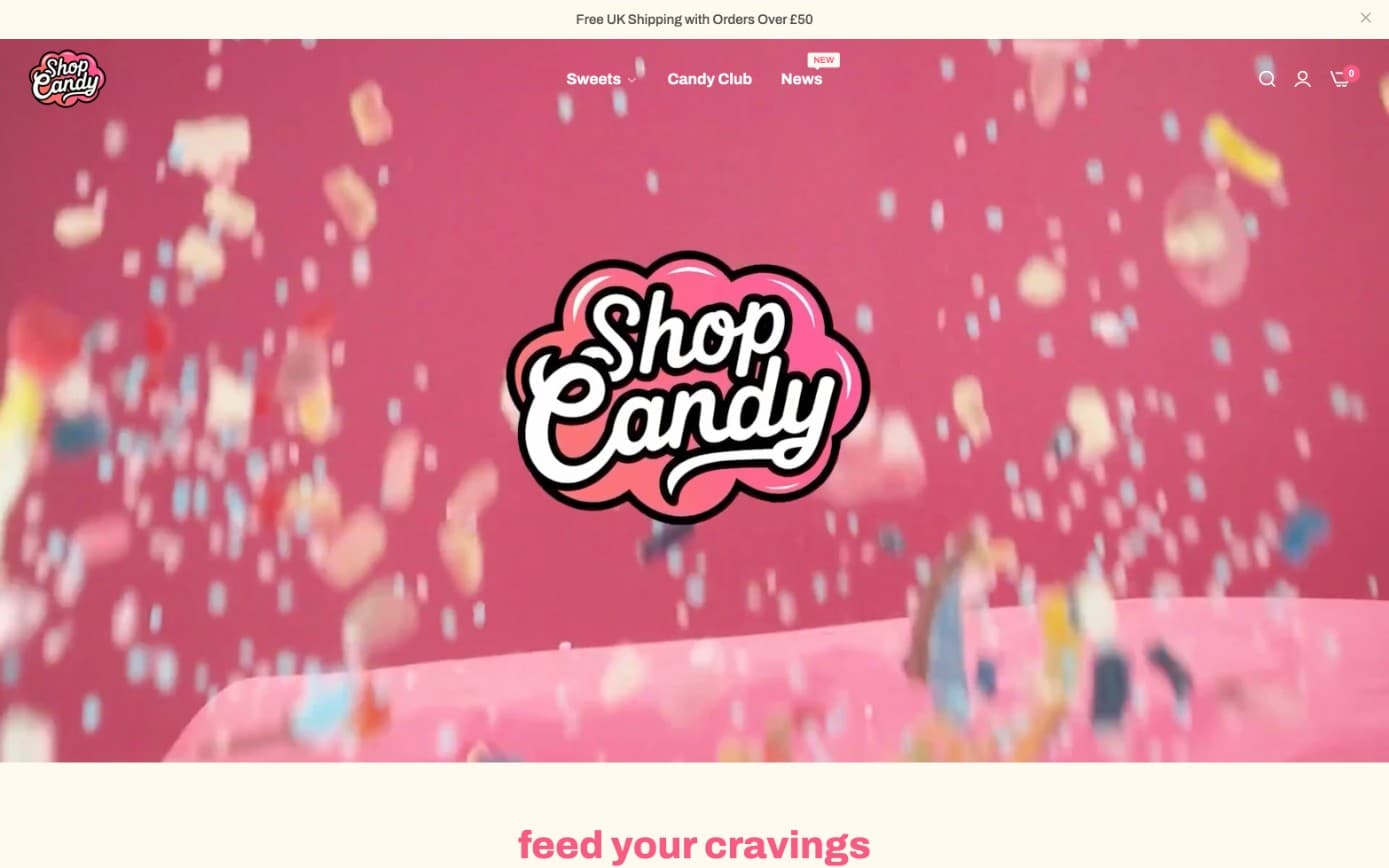 The Shop Candy homepage with its logo over a shower of falling sweets