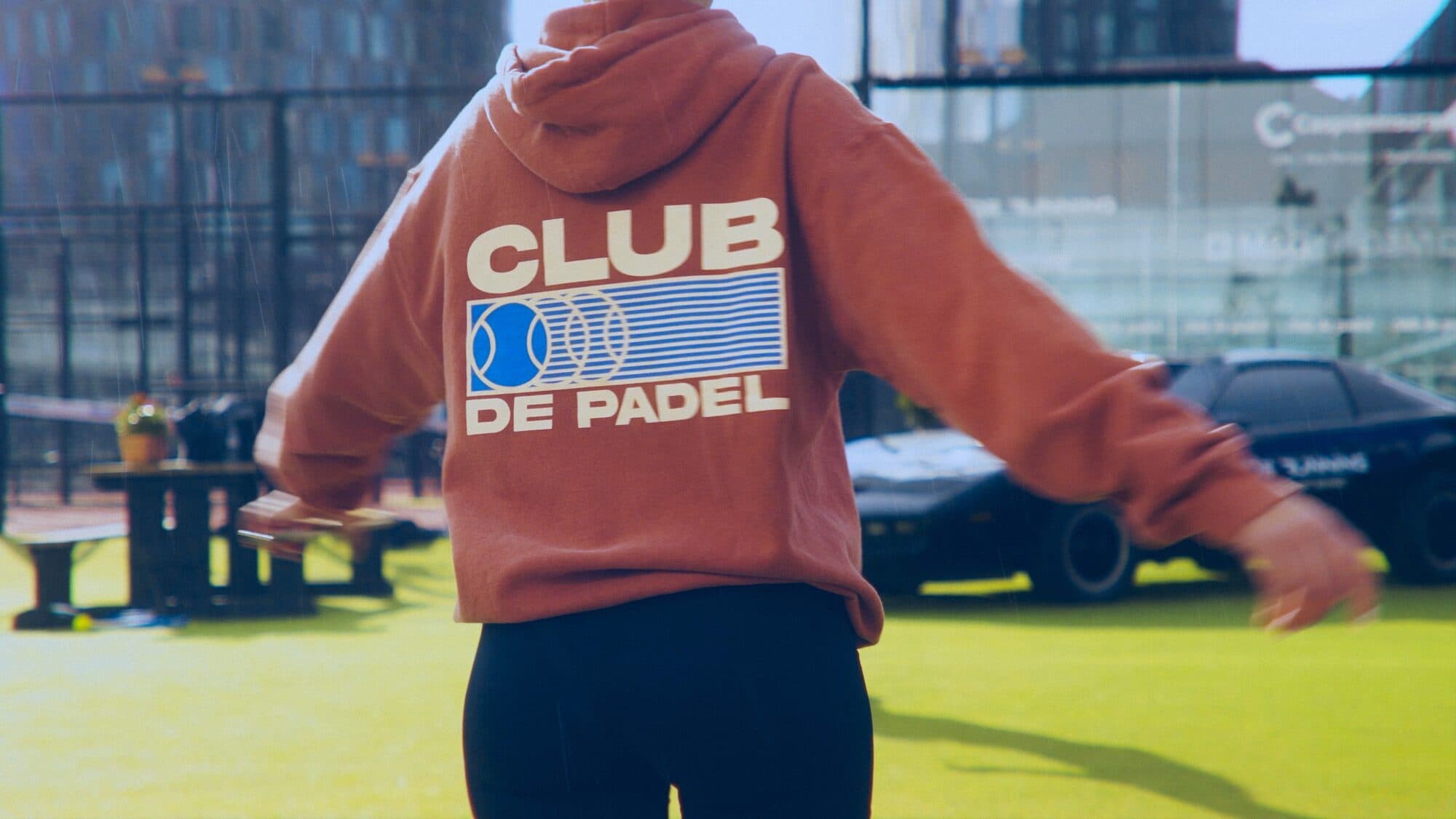 The back of a red Club de Padel hoodie